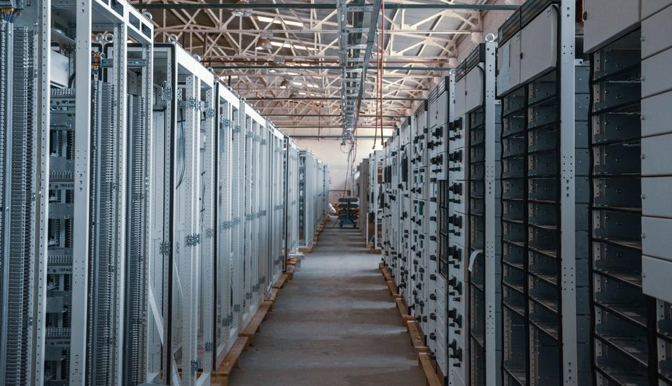Long aisle of server racks in a data centre