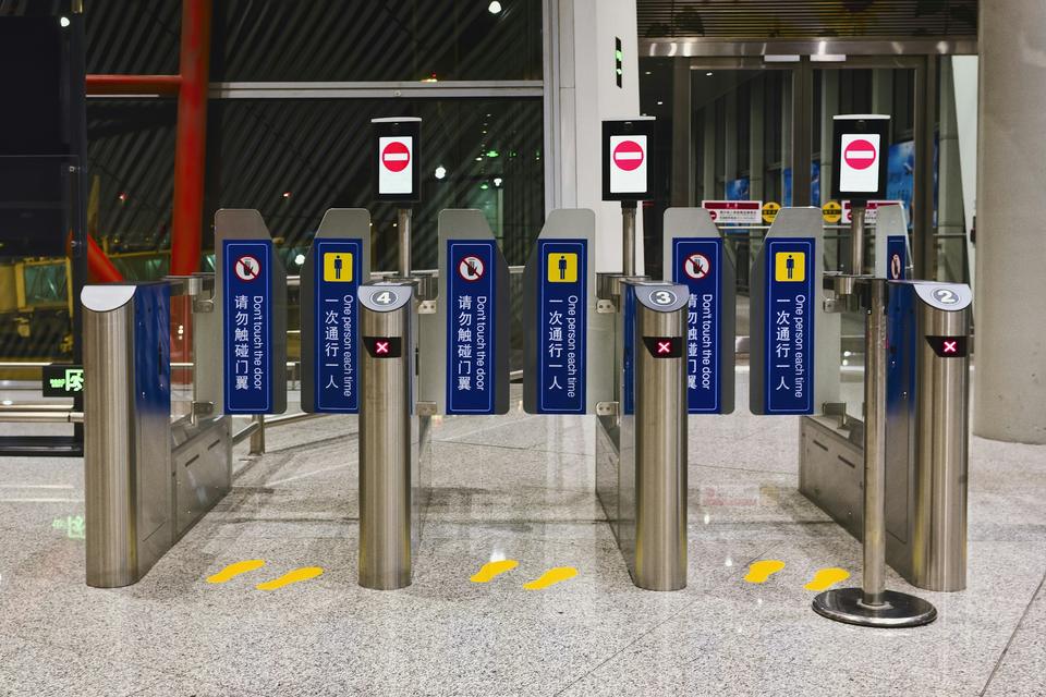 Access-controlled turnstile gates at a building entrance